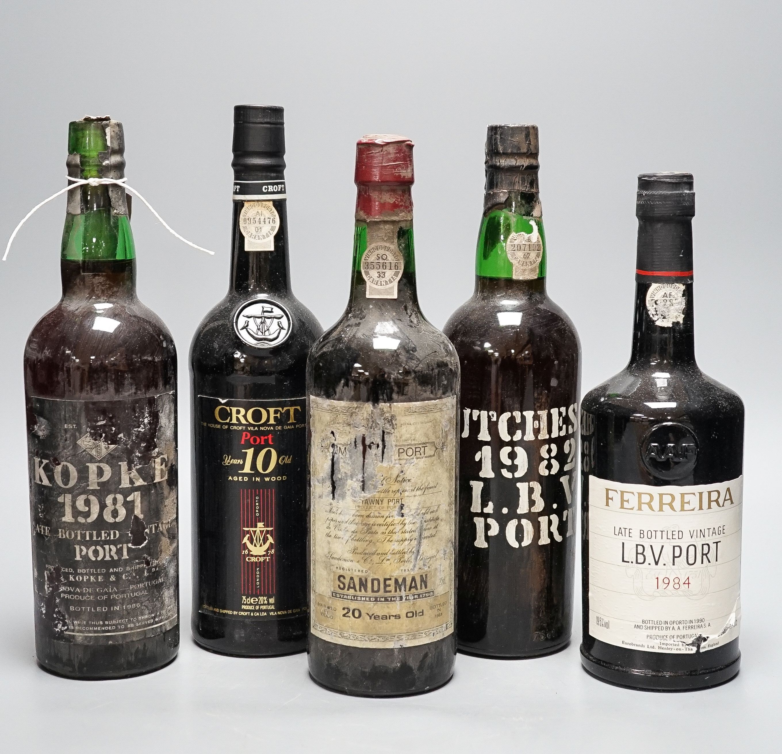 Five bottles - Kopke LBV (bottled 1986), Hutcheson LBV (bottled 1988), Feirraira LBV (bottled 1990), Croft 10 year old Tawny (bottled 1990) and Sandeman 20 year old Tawny Port (bottled 1981), all 75cl.